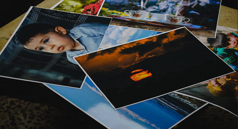 Printed photographs of different events that spark emotions in your target audience